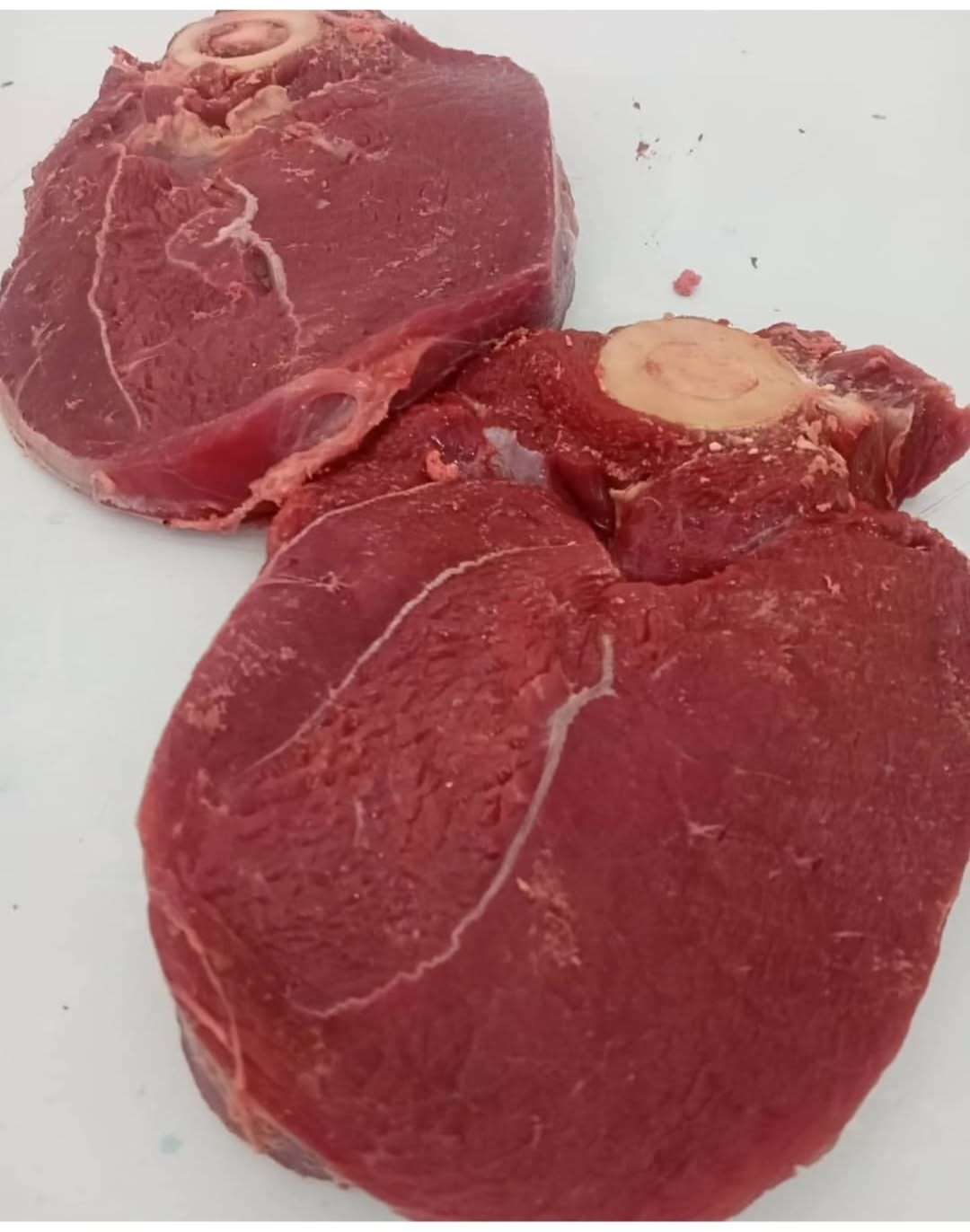 Customer selecting fresh quality meat from a trusted butchery