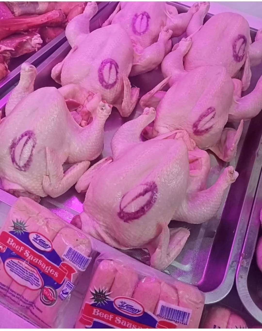 Customer selecting fresh quality meat from a trusted butchery